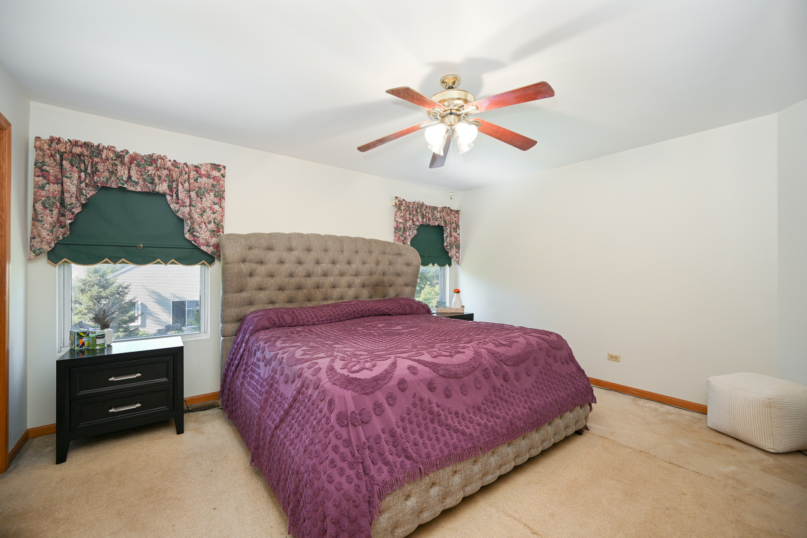 5805 Emerald Pointe Drive Plainfield, IL 60586 - Photo 13 of 25 a bedroom with a bed and a painting on the wall