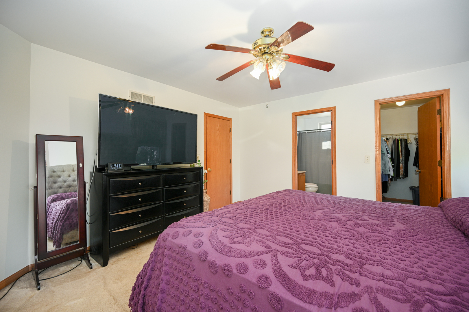 5805 Emerald Pointe Drive Plainfield, IL 60586 - Photo 14 of 25 a bedroom with a bed and a flat screen tv