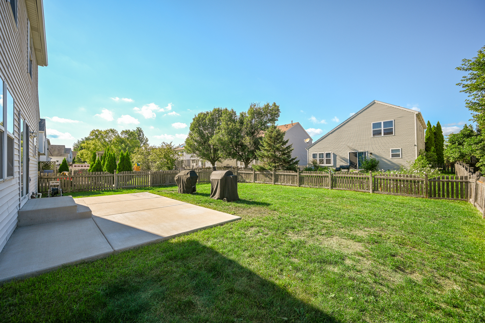 5805 Emerald Pointe Drive Plainfield, IL 60586 - Photo 23 of 25 a view of a house with a yard and basketball court