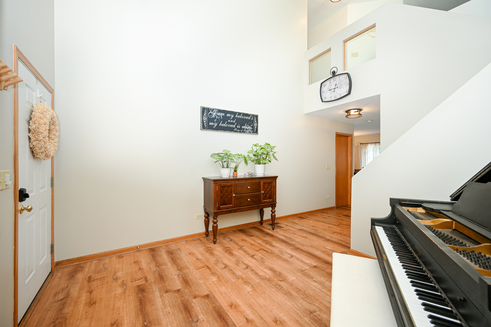 5805 Emerald Pointe Drive Plainfield, IL 60586 - Photo 4 of 25 a bedroom with a bed and a piano