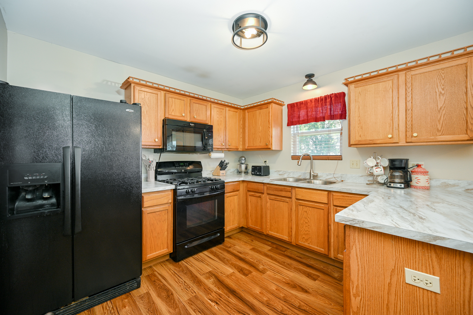 5805 Emerald Pointe Drive Plainfield, IL 60586 - Photo 9 of 25 a kitchen with stainless steel appliances granite countertop a refrigerator stove top oven a sink and dishwasher
