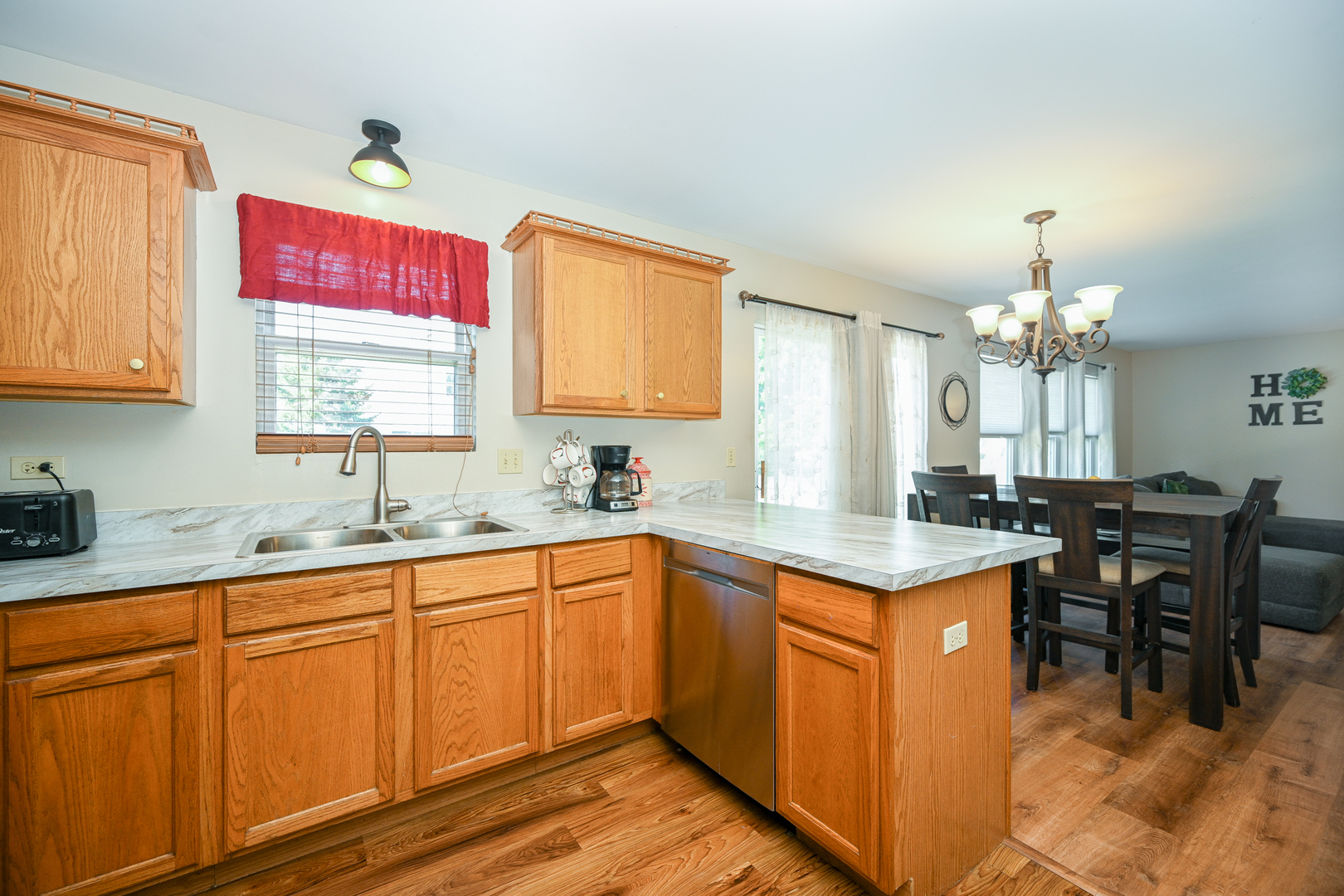 5805 Emerald Pointe Drive Plainfield, IL 60586 - Photo 10 of 25 a kitchen with granite countertop a sink cabinets and window