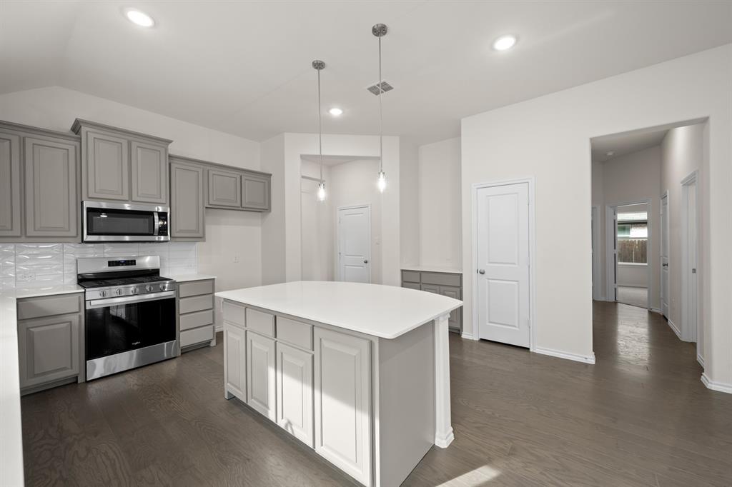 810 Misty Lane Cleburne, TX 76033 - Photo 2 of 30 a kitchen that has a sink and stainless steel appliances