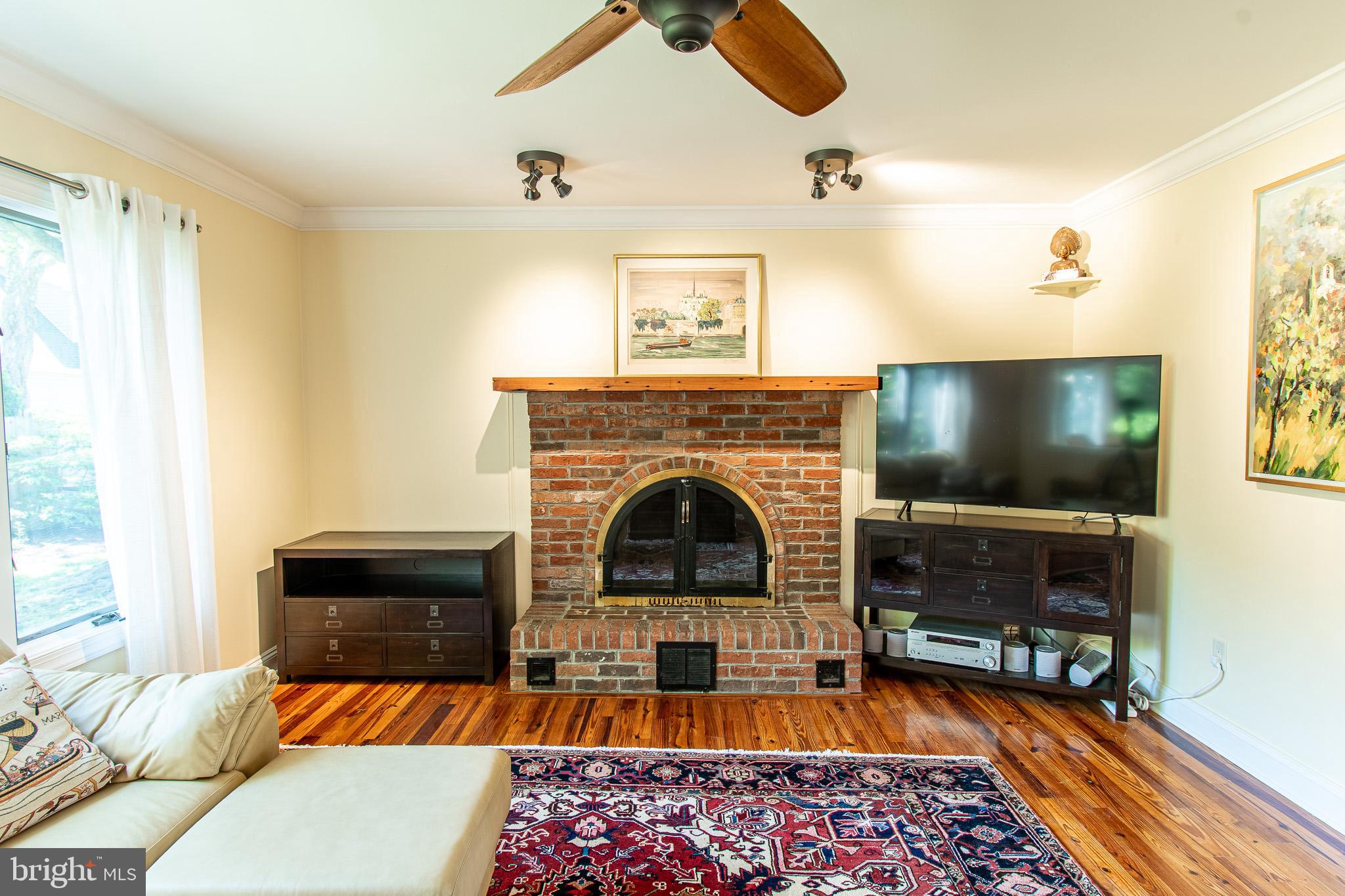 102 Jacks Point Road Oxford, MD 21654 - Photo 27 of 83 a living room with furniture and a fireplace