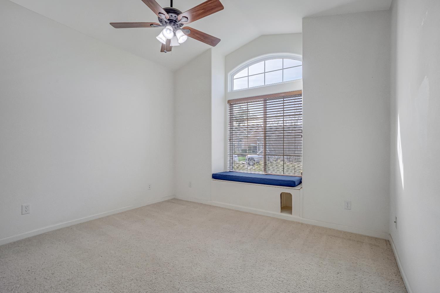 3062 North Filbert Avenue Fresno, CA 93727 - Photo 12 of 41 an empty room with windows and fan