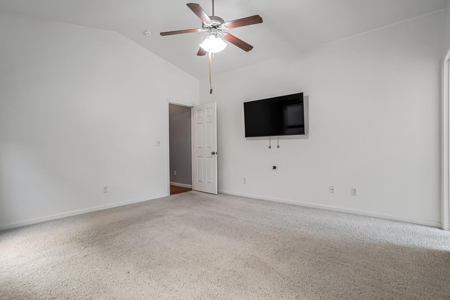 3062 North Filbert Avenue Fresno, CA 93727 - Photo 17 of 41 a view of an empty room with a ceiling fan