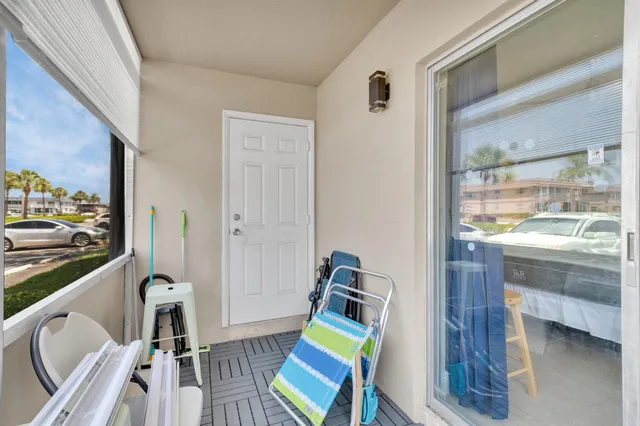 a room with furniture and a view of kitchen