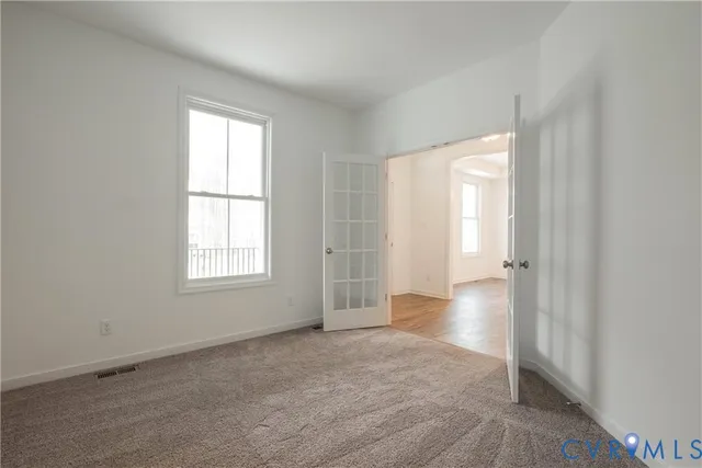 a kitchen with granite countertop a stove and a refrigerator