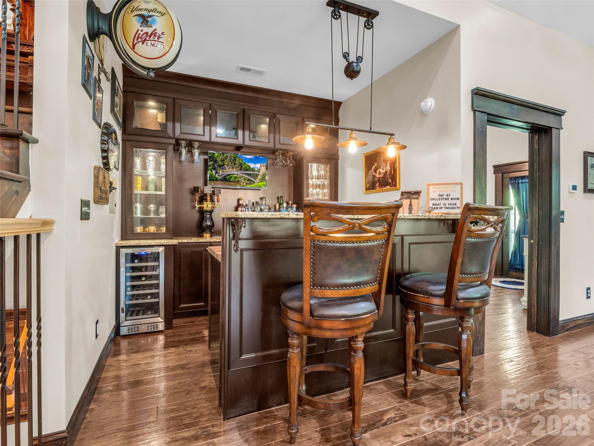 174 Rock Ridge Lake Lure, NC 28746 - Photo 11 of 48 a dining table with chairs and wooden floor