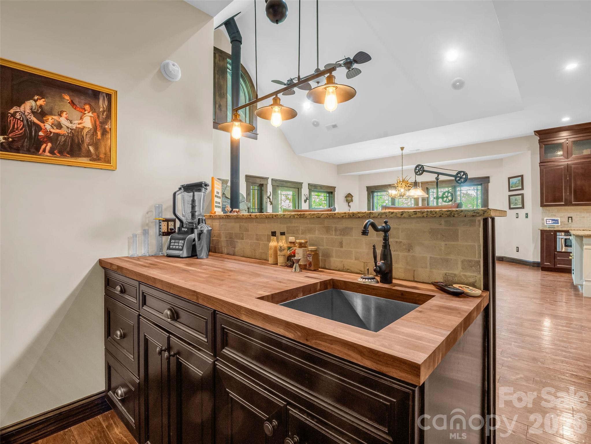 174 Rock Ridge Lake Lure, NC 28746 - Photo 13 of 48 a kitchen with a sink a counter space and stainless steel appliances