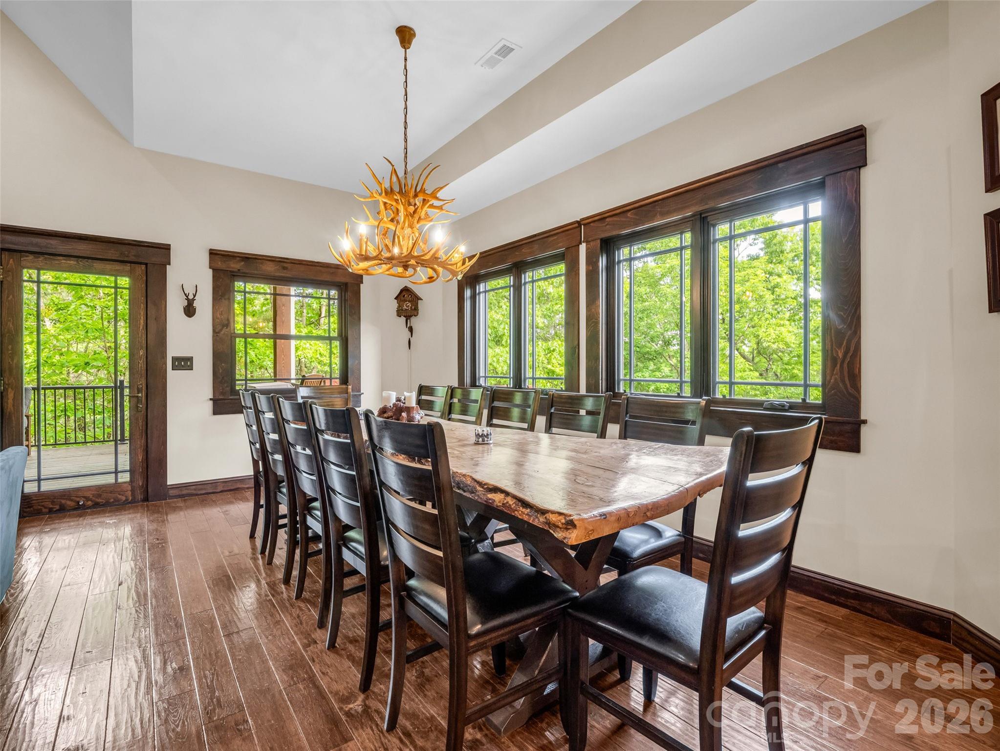 174 Rock Ridge Lake Lure, NC 28746 - Photo 14 of 48 a view of a dining room with furniture window and wooden floor