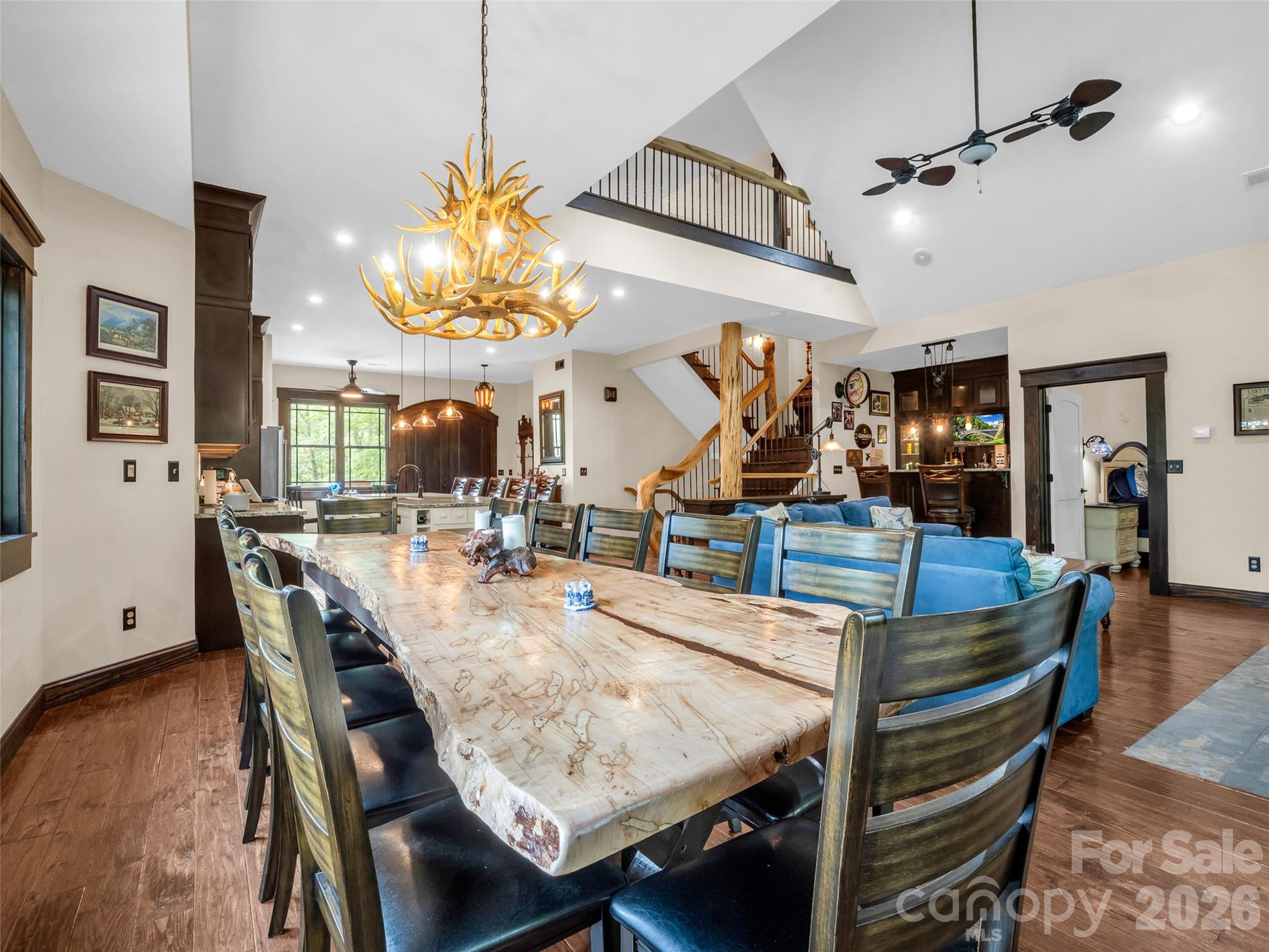 174 Rock Ridge Lake Lure, NC 28746 - Photo 15 of 48 a view of a dining room with furniture and wooden floor