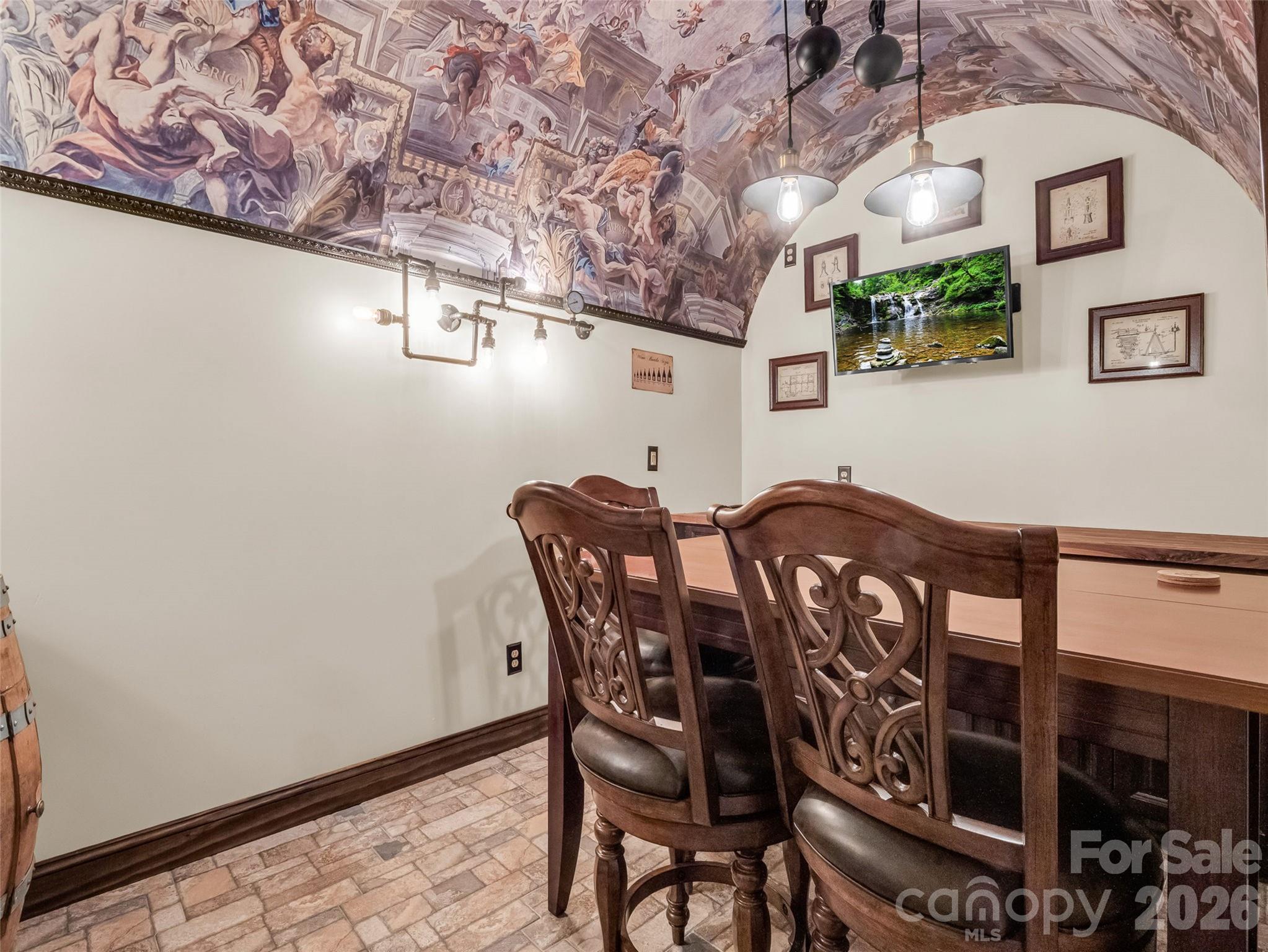 174 Rock Ridge Lake Lure, NC 28746 - Photo 28 of 48 a view of a dining room with furniture and wooden floor