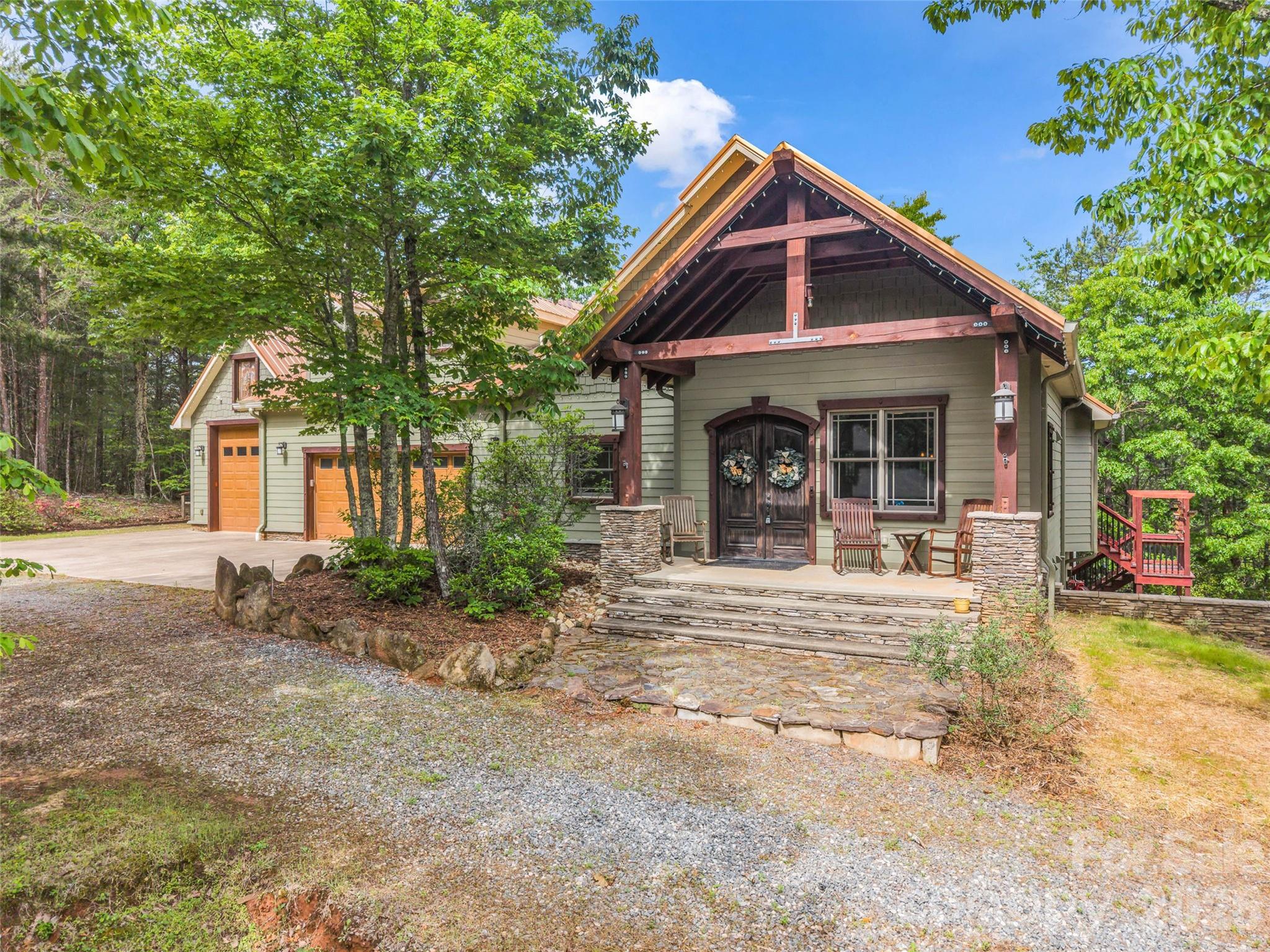 174 Rock Ridge Lake Lure, NC 28746 - Photo 3 of 48 a view of a house with backyard porch and sitting area