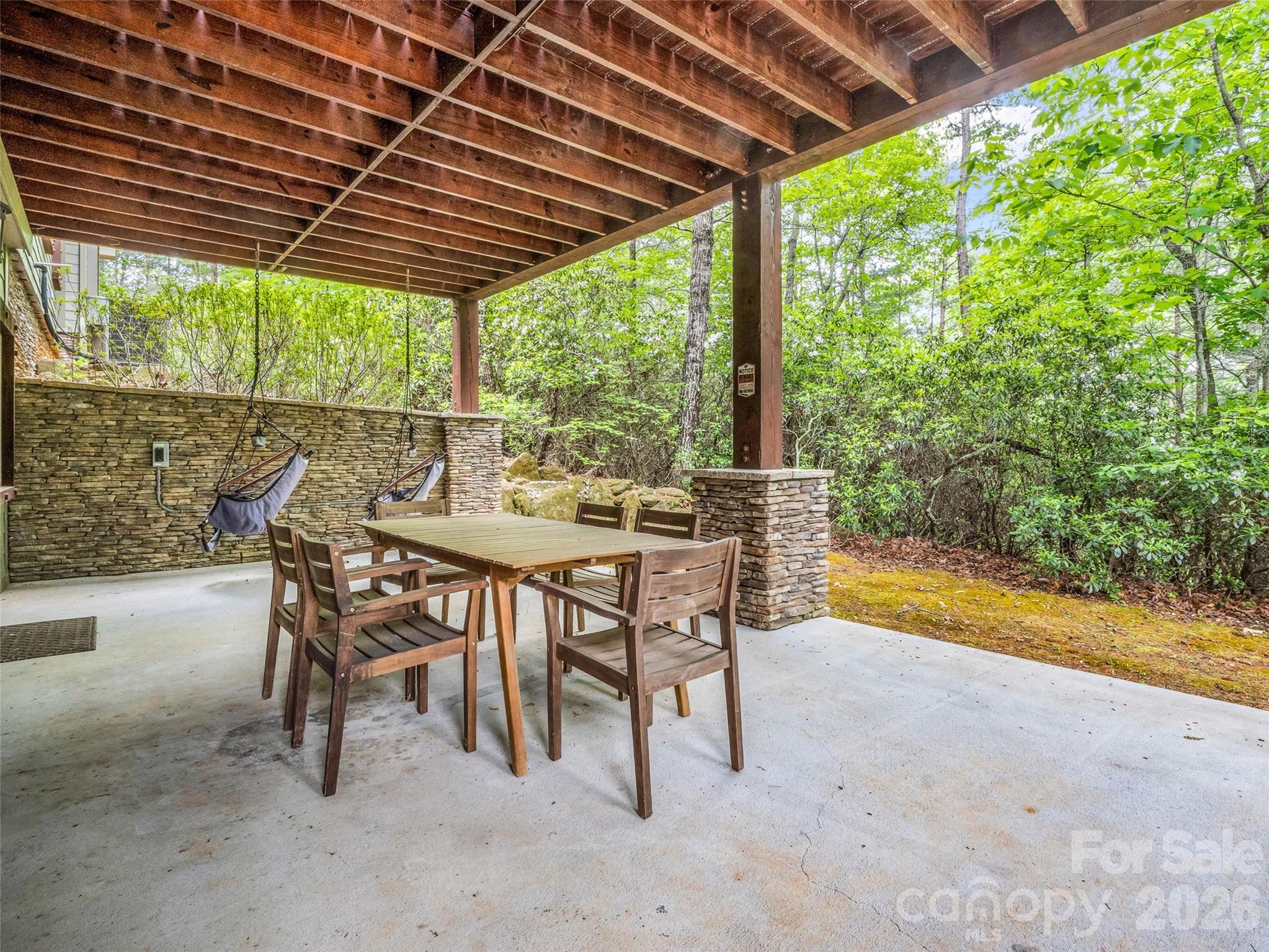 174 Rock Ridge Lake Lure, NC 28746 - Photo 36 of 48 a dining room with furniture and garden view