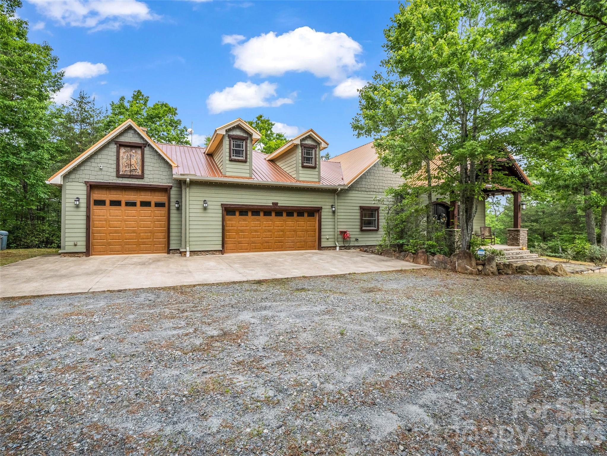 174 Rock Ridge Lake Lure, NC 28746 - Photo 4 of 48 a view of a house with a yard and garage