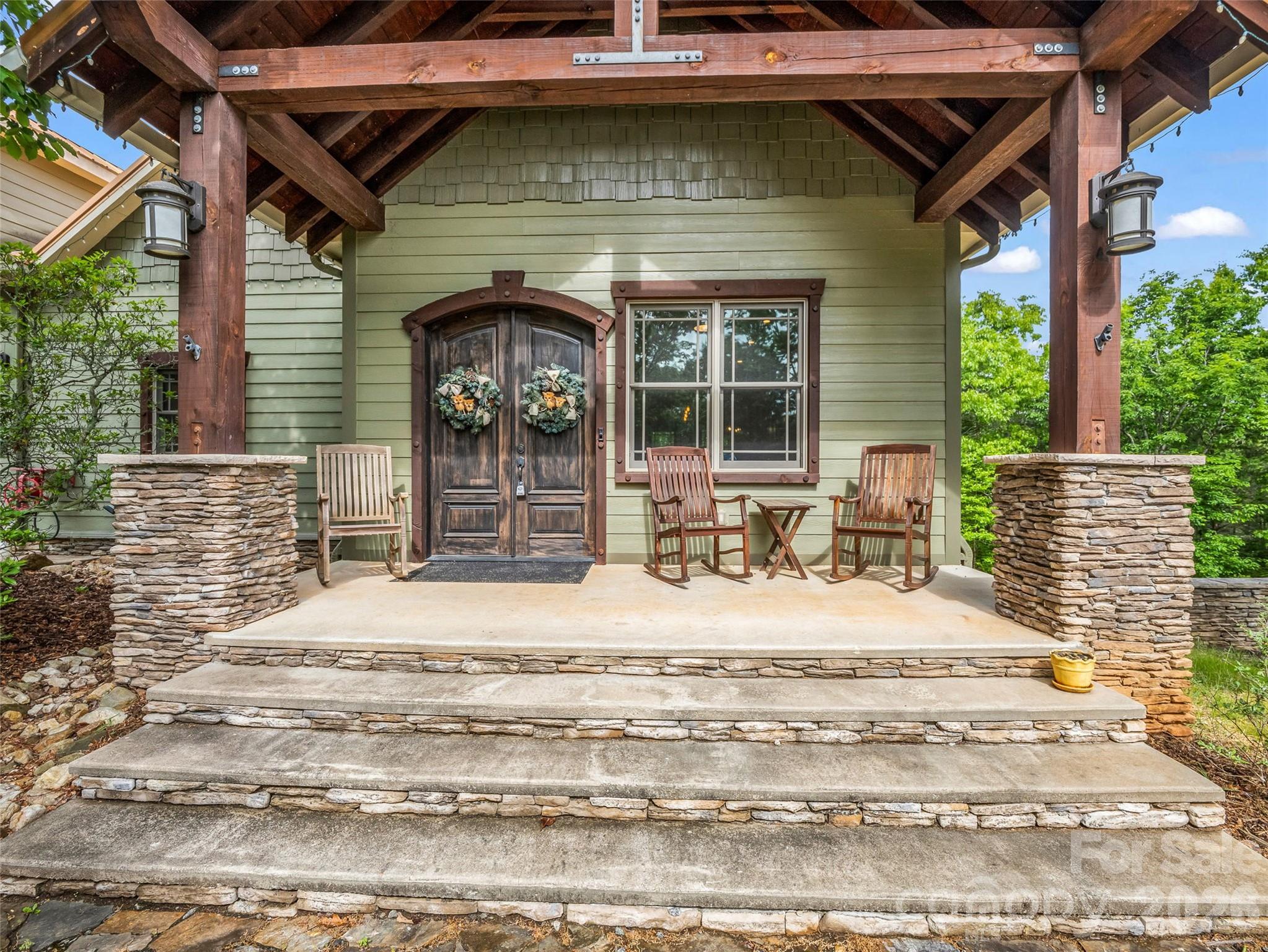 174 Rock Ridge Lake Lure, NC 28746 - Photo 5 of 48 a bedroom with a bed and window