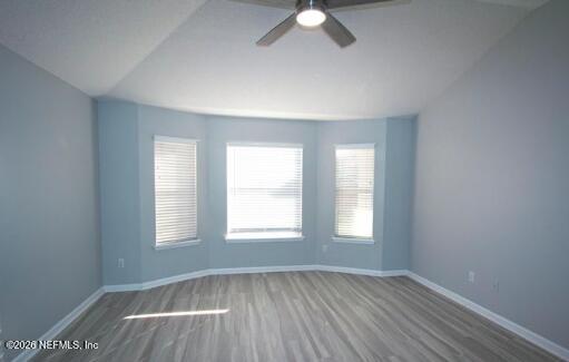 1113 Andrea Way St. Johns, FL 32259 - Photo 10 of 30 an empty room with wooden floor fan and window