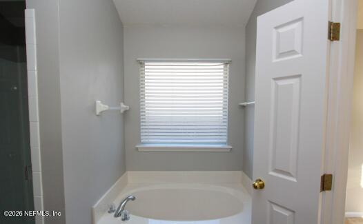 1113 Andrea Way St. Johns, FL 32259 - Photo 12 of 30 a white bath tub sitting next to a window