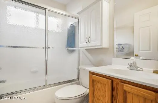 a view of an empty room and wooden floor