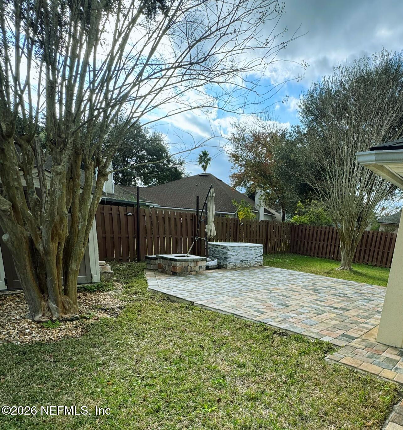 1113 Andrea Way St. Johns, FL 32259 - Photo 19 of 30 a backyard of house with a slide and large trees
