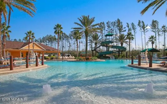 a view of a town with palm trees