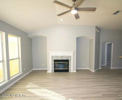 1113 Andrea Way St. Johns, FL 32259 - Photo 6 of 30 a view of an empty room with wooden floor fireplace and a window