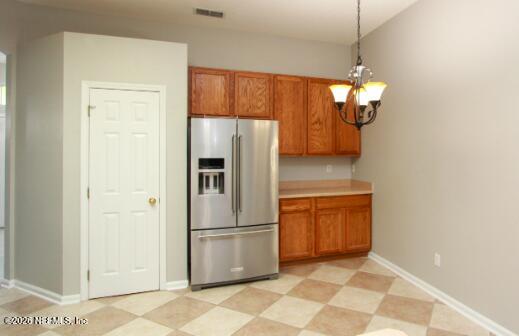 1113 Andrea Way St. Johns, FL 32259 - Photo 8 of 30 a kitchen with stainless steel appliances a refrigerator and cabinets