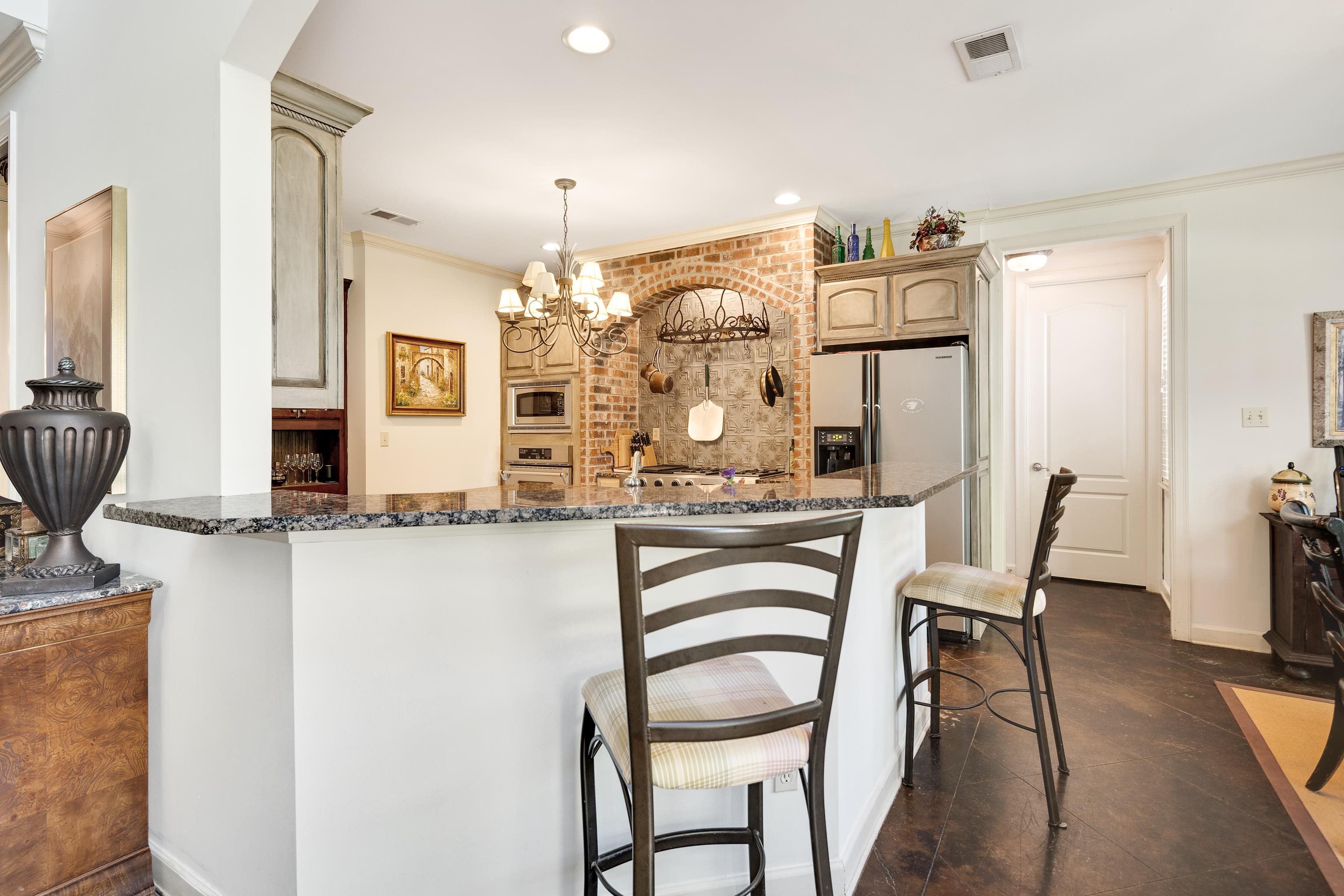 210 Ivy Grove Lane Collierville, TN 38017 - Photo 13 of 40 a dining room with furniture and wooden floor