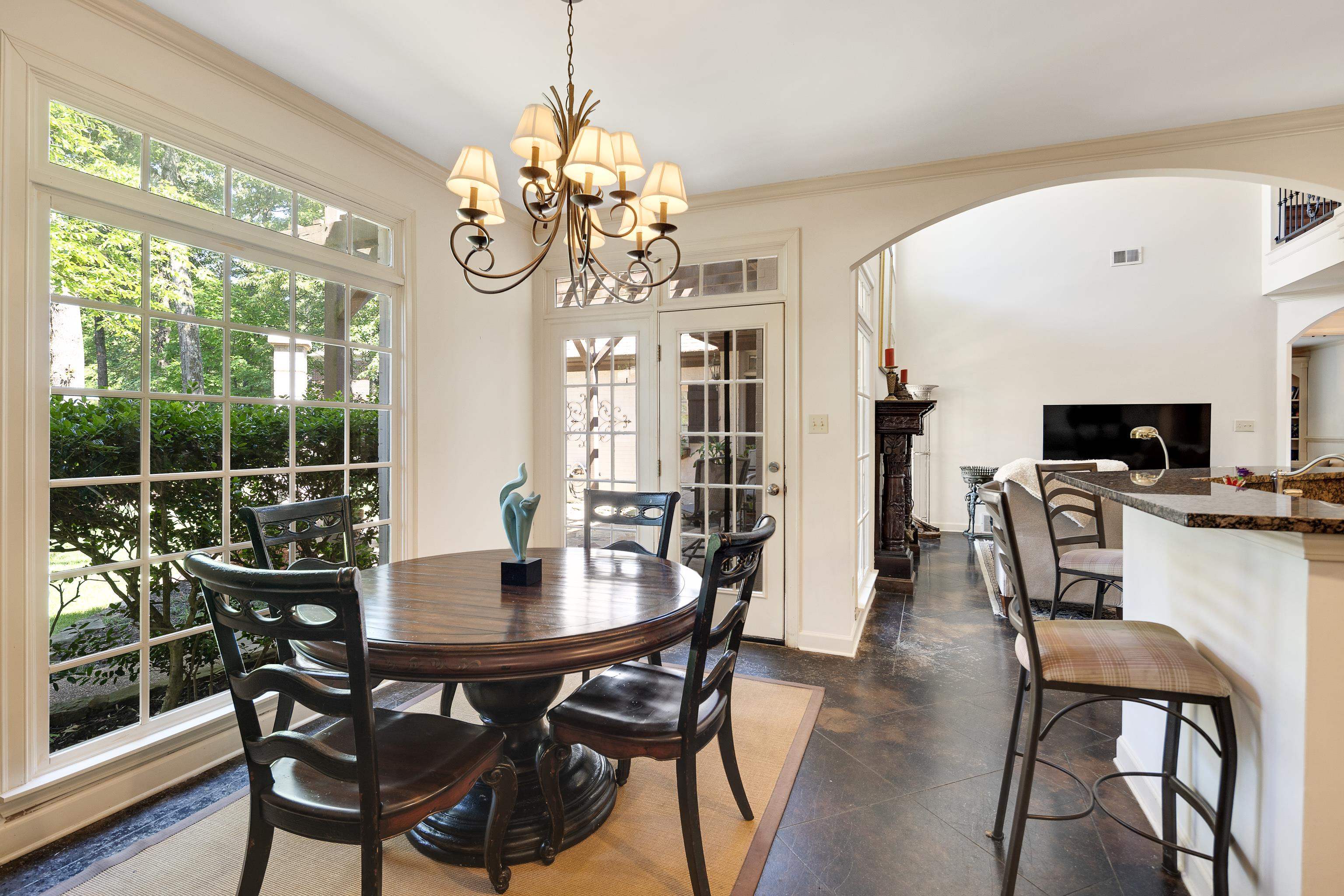 210 Ivy Grove Lane Collierville, TN 38017 - Photo 15 of 40 a view of a dining room with furniture a chandelier and wooden floor