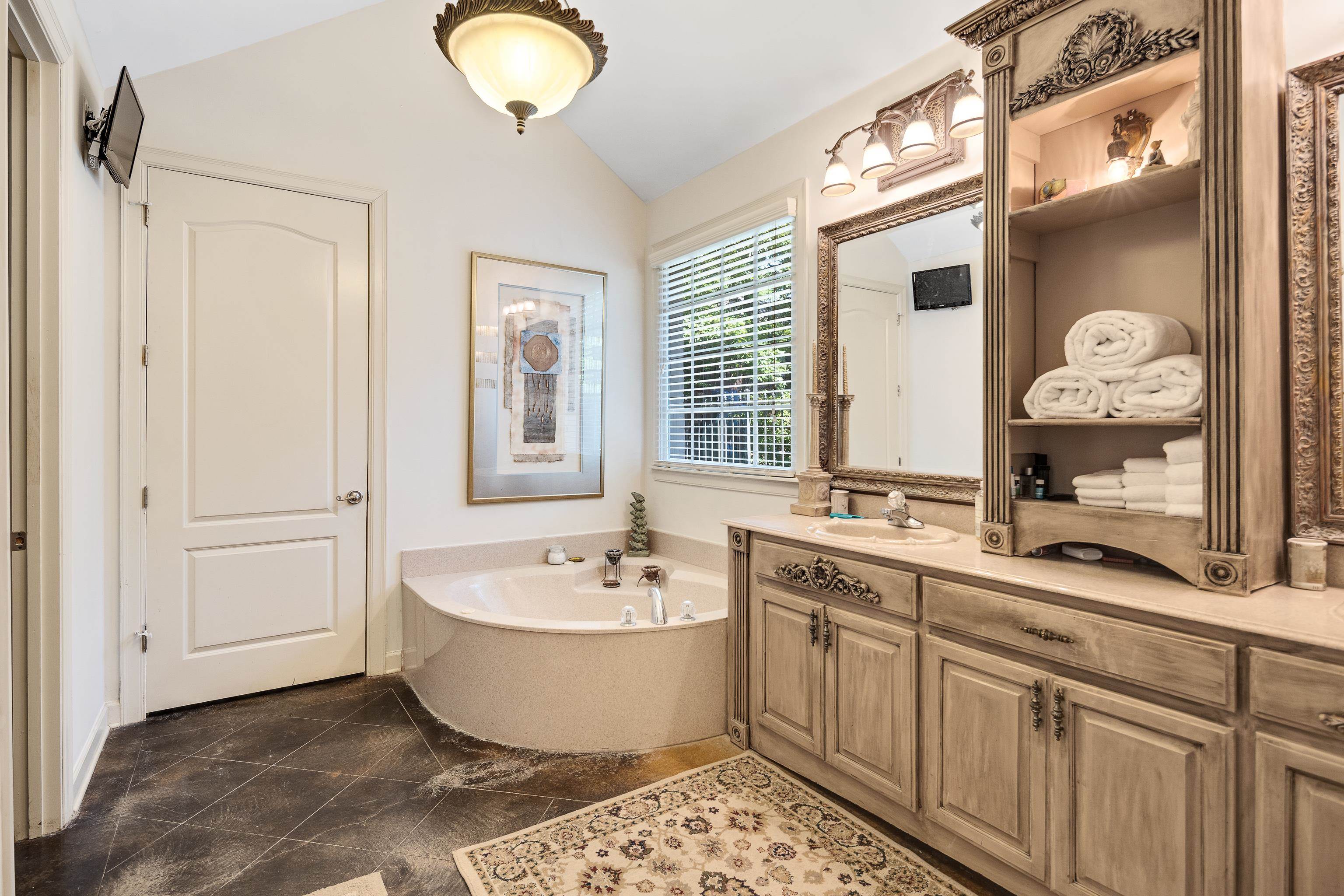 210 Ivy Grove Lane Collierville, TN 38017 - Photo 22 of 40 a spacious bathroom with a double vanity sink mirror and bathtub