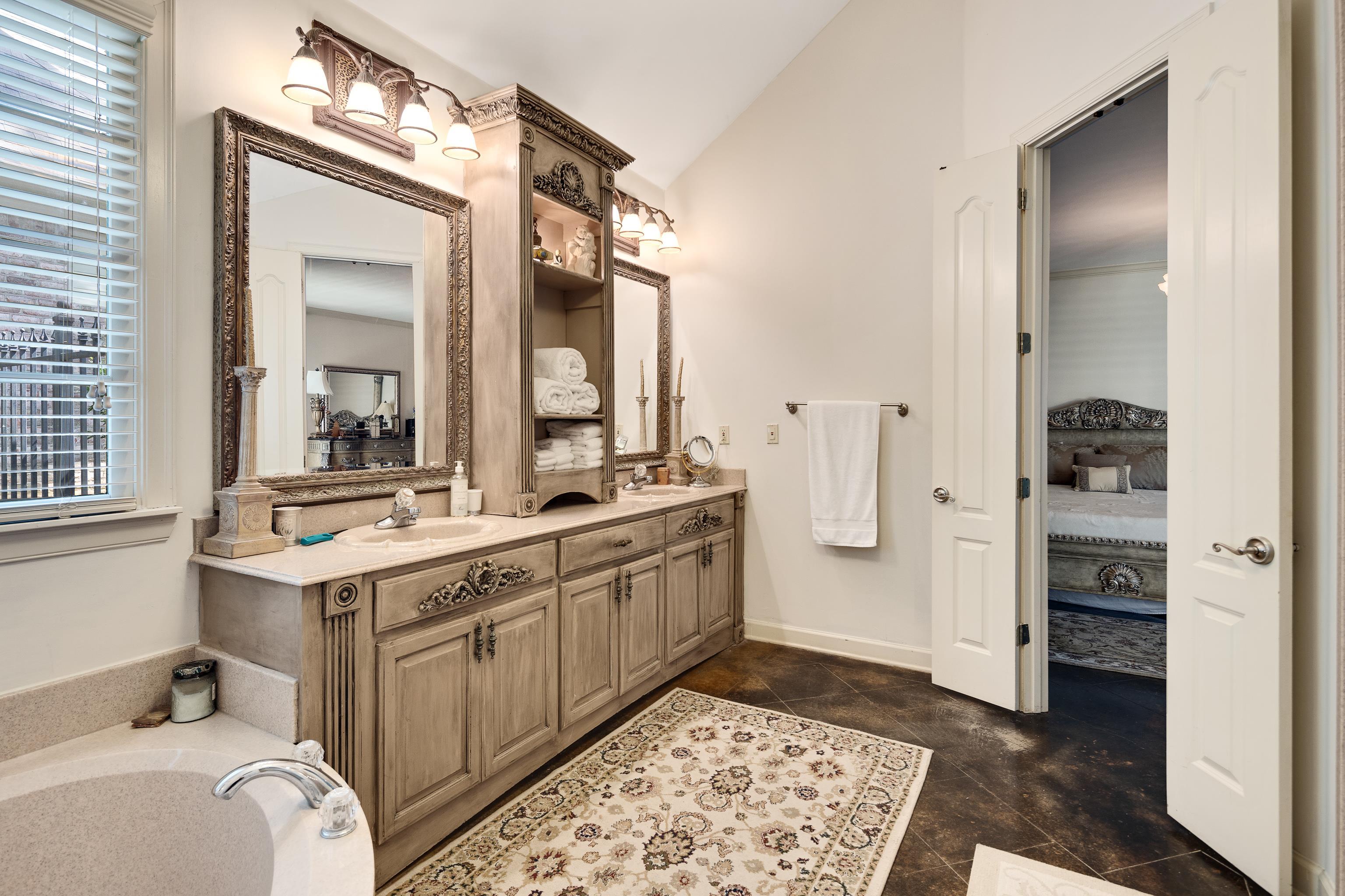210 Ivy Grove Lane Collierville, TN 38017 - Photo 23 of 40 a kitchen with a sink and refrigerator