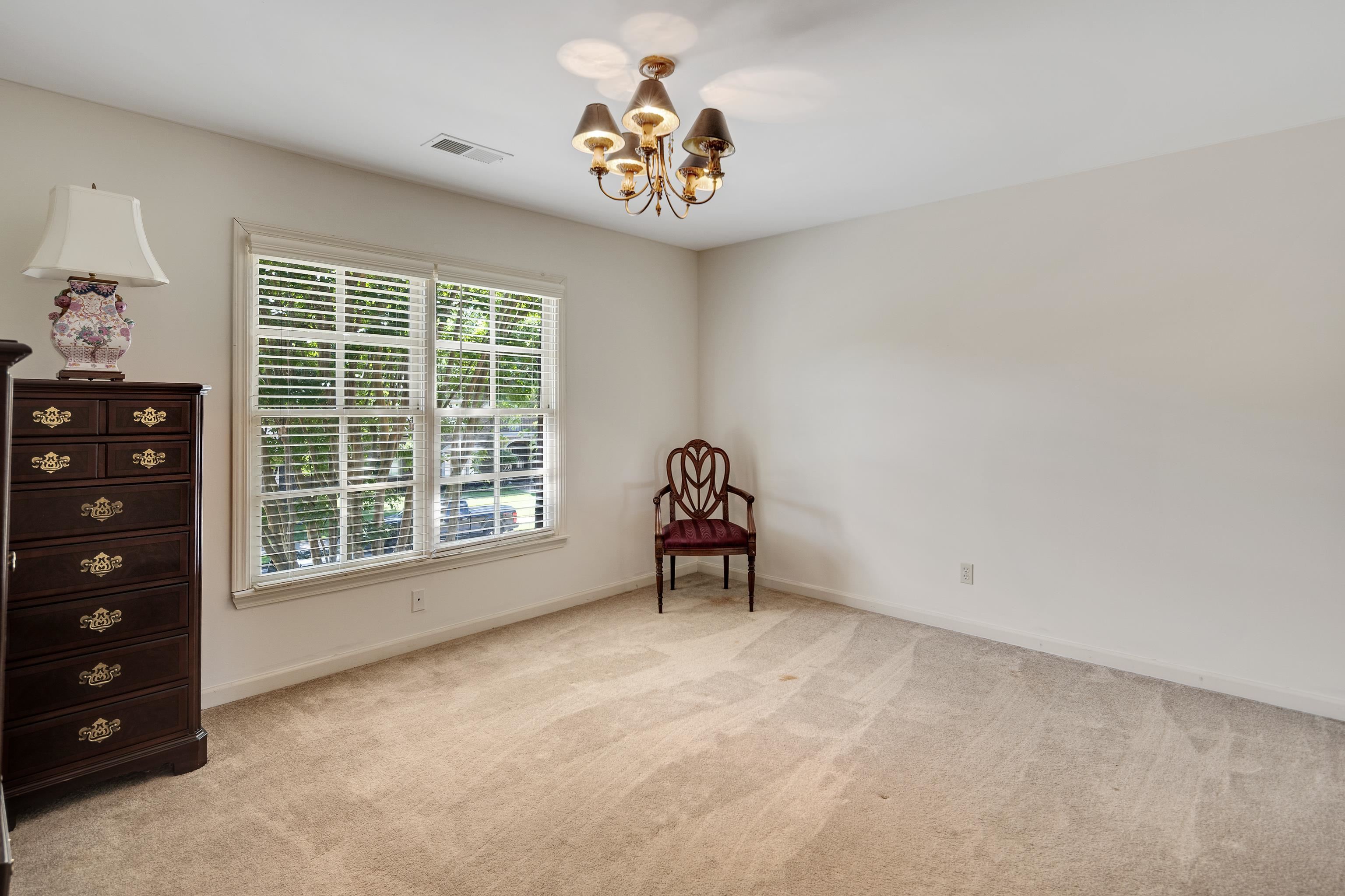 210 Ivy Grove Lane Collierville, TN 38017 - Photo 29 of 40 wooden floor in an empty room with a window