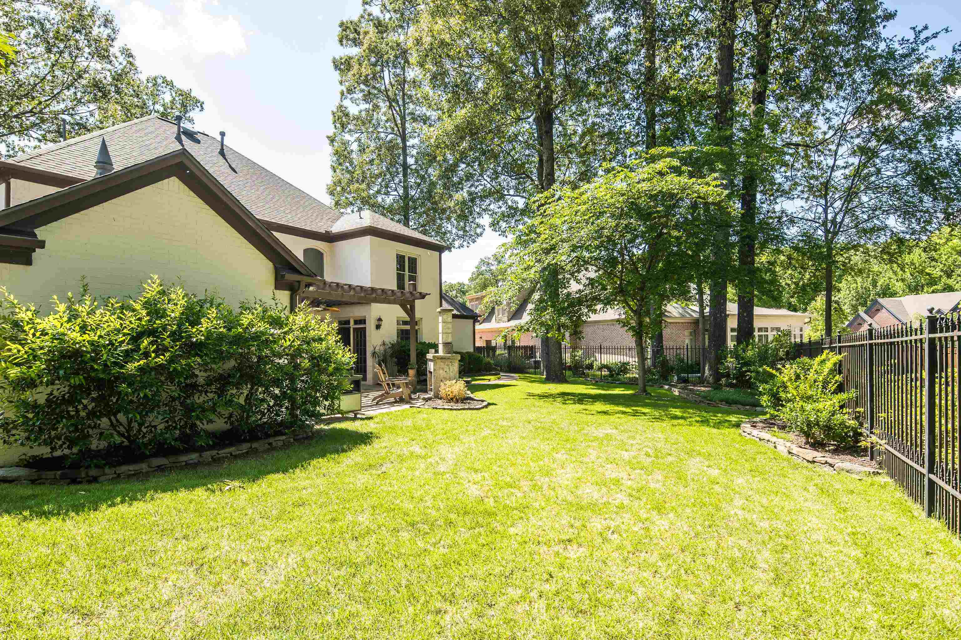 210 Ivy Grove Lane Collierville, TN 38017 - Photo 40 of 40 a view of a house with a yard and a garden