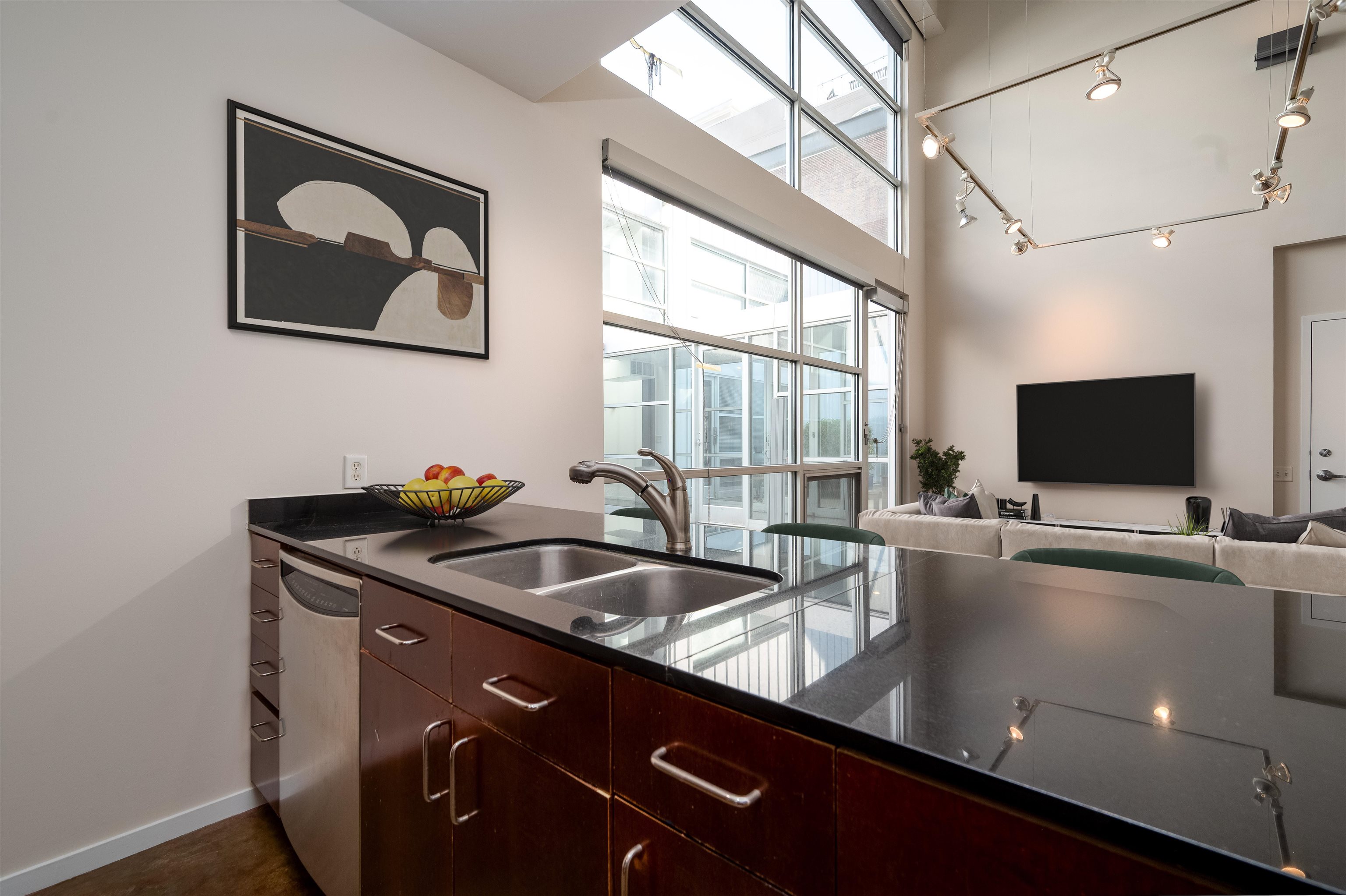 415 South Front Street, Unit 114 Memphis, TN 38103 - Photo 6 of 26 a view of room with a flat screen tv and a large window