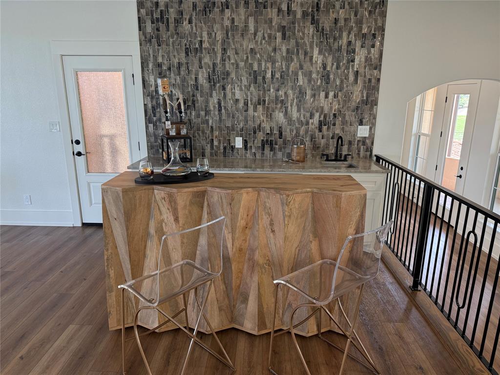 7085 West Hells Gate Drive Strawn, TX 76475 - Photo 33 of 40 a view of a room with wooden floor and windows