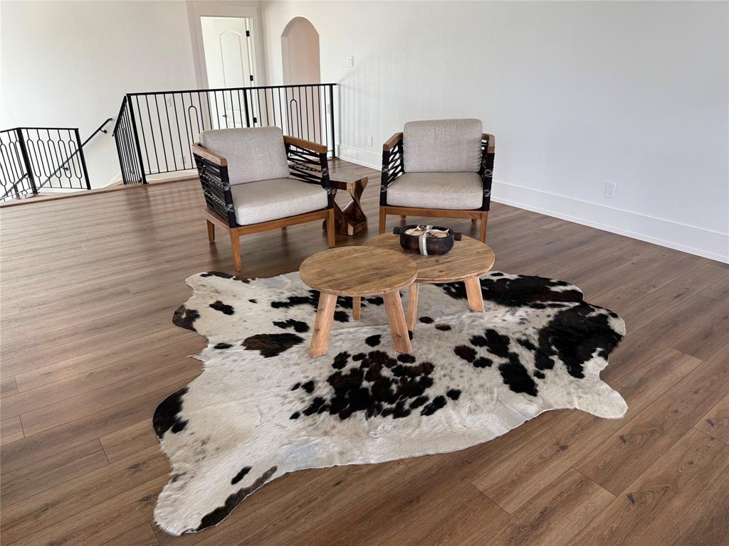 7085 West Hells Gate Drive Strawn, TX 76475 - Photo 35 of 40 a dining room with furniture and wooden floor
