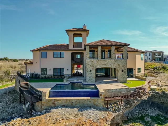an aerial view of a house with a ocean view