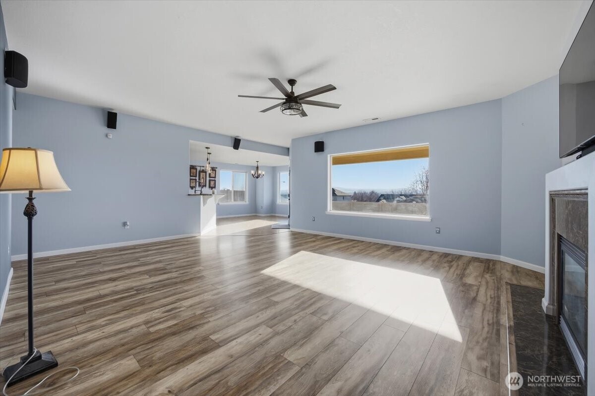 6304 Turf Paradise Drive Pasco, WA 99301 - Photo 16 of 40 wooden floor in an empty room with a window