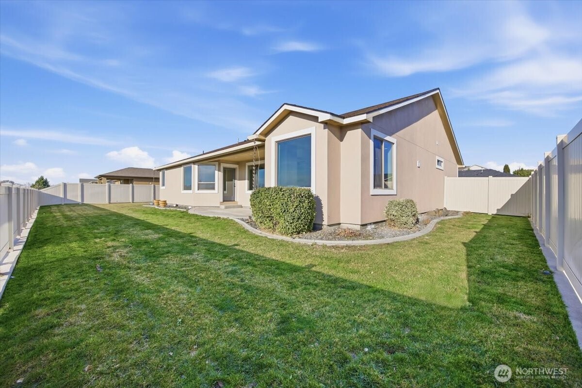 6304 Turf Paradise Drive Pasco, WA 99301 - Photo 32 of 40 a house view with a garden space