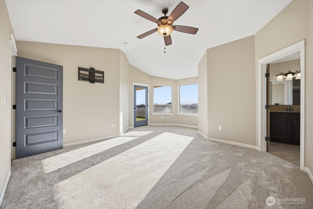 6304 Turf Paradise Drive Pasco, WA 99301 - Photo 8 of 40 a big room with closet and a chandelier fan