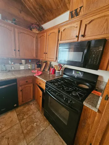 a kitchen with a stove and a sink