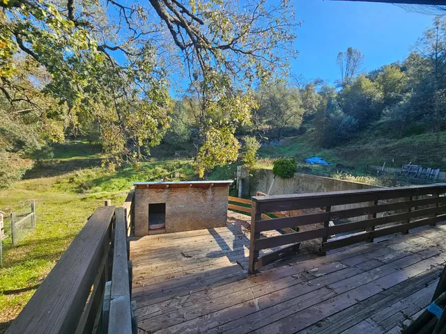 a view of a wooden bench next to a lake