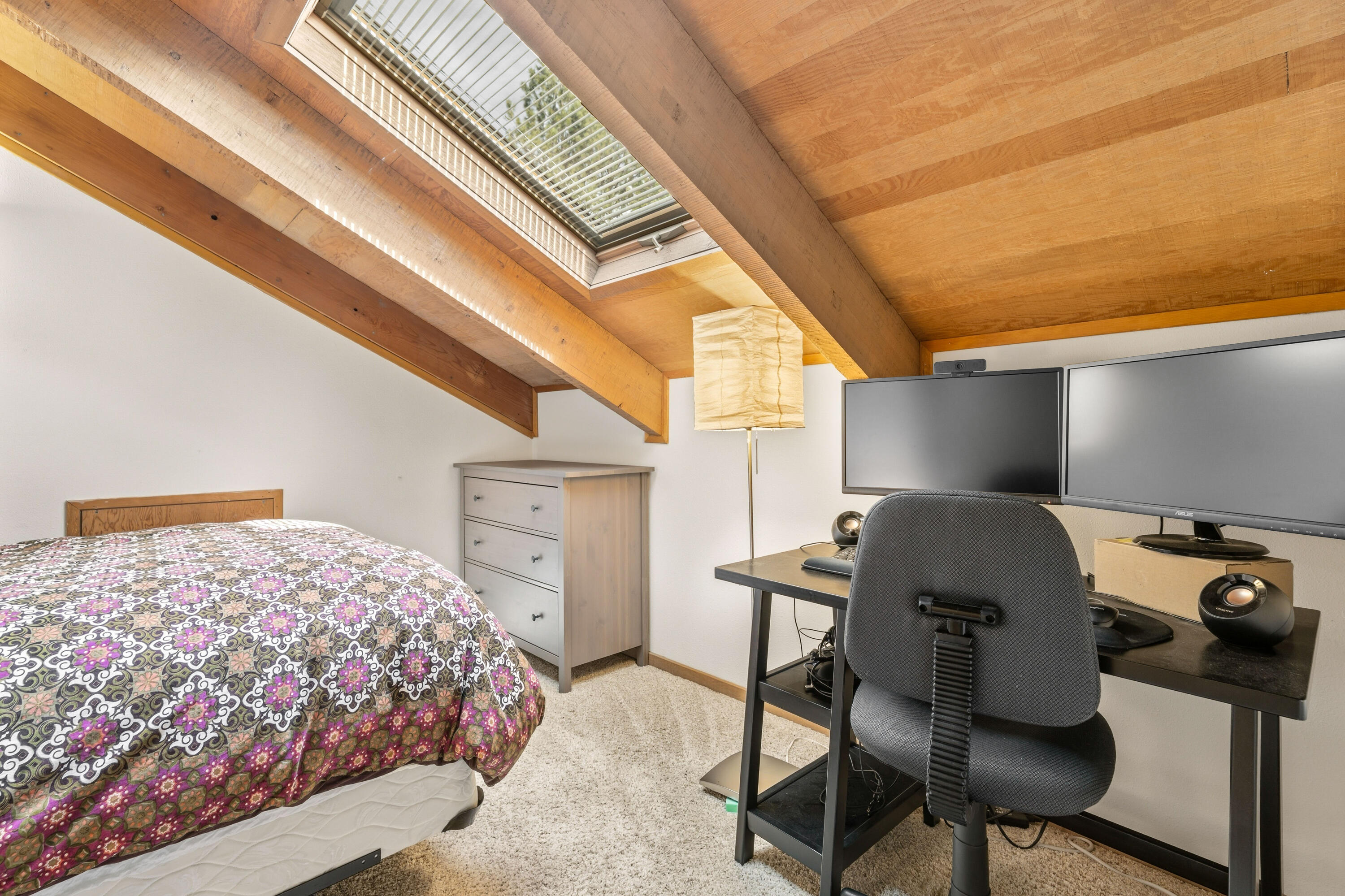 17866 Grouse Lane, Unit 3 Sunriver, OR 97707 - Photo 25 of 61 a bedroom with a bed and a chandelier