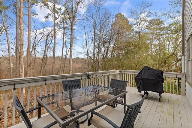 a view of a chairs and table on the deck