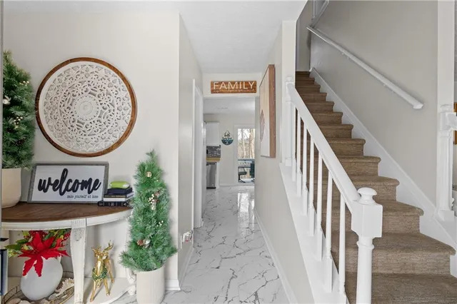 a view of a room with painting on the wall