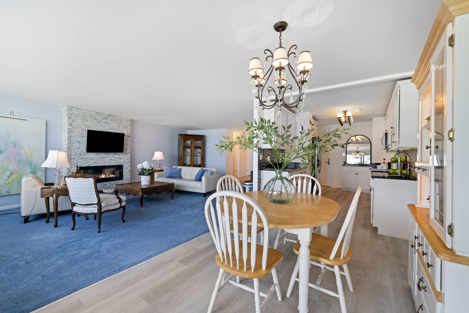 1630 Sheridan Road, Unit 2F Wilmette, IL 60091 - Photo 7 of 25 a dining room with furniture a chandelier and wooden floor