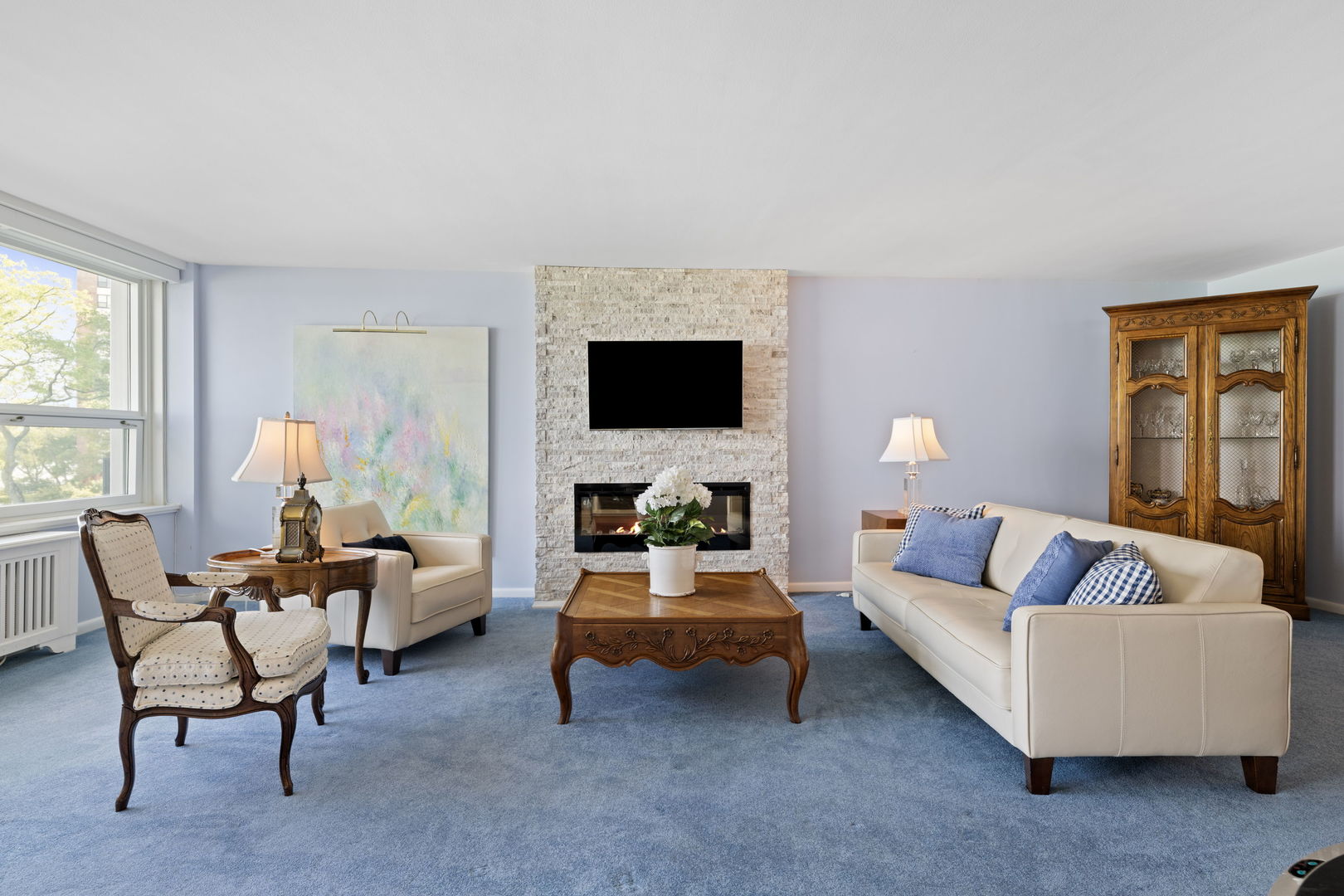 1630 Sheridan Road, Unit 2F Wilmette, IL 60091 - Photo 9 of 25 a living room with furniture and a flat screen tv