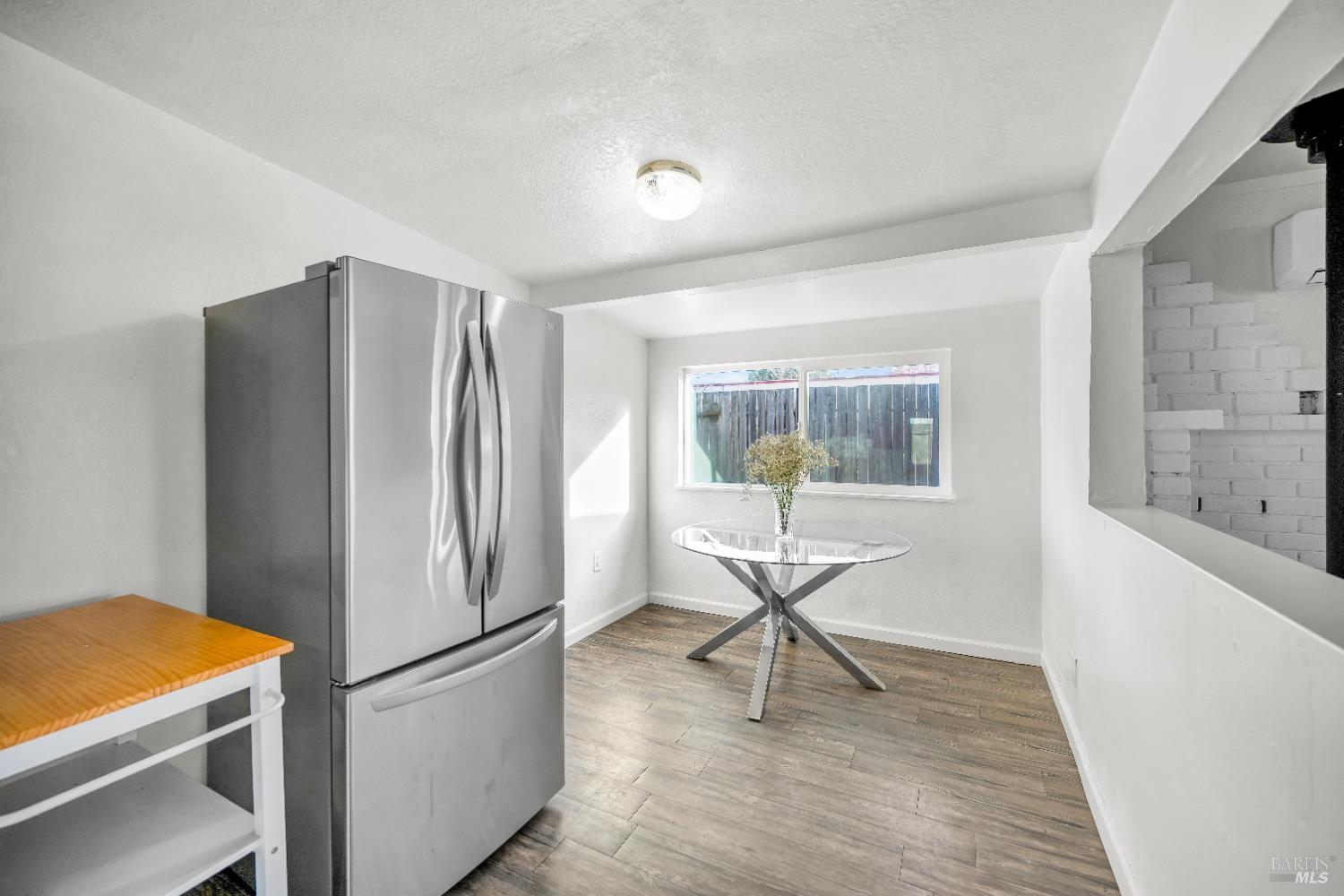 160 Thomas Street Ukiah, CA 95482 - Photo 11 of 26 a kitchen with stainless steel appliances granite countertop a refrigerator and a stove top oven