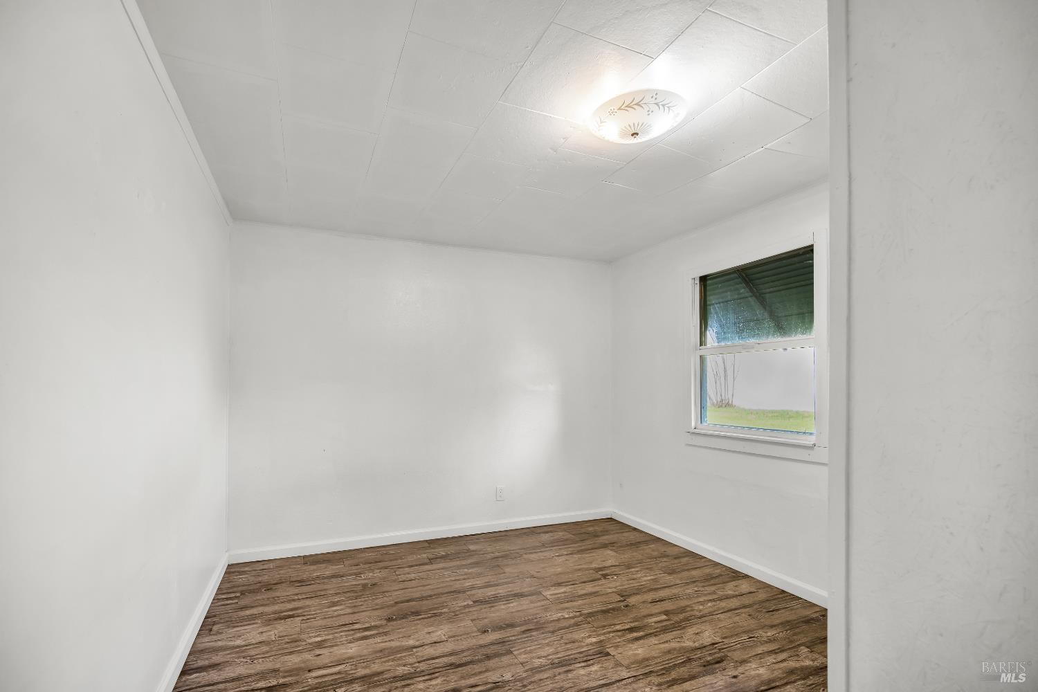 160 Thomas Street Ukiah, CA 95482 - Photo 14 of 26 a view of an empty room with a window and closet